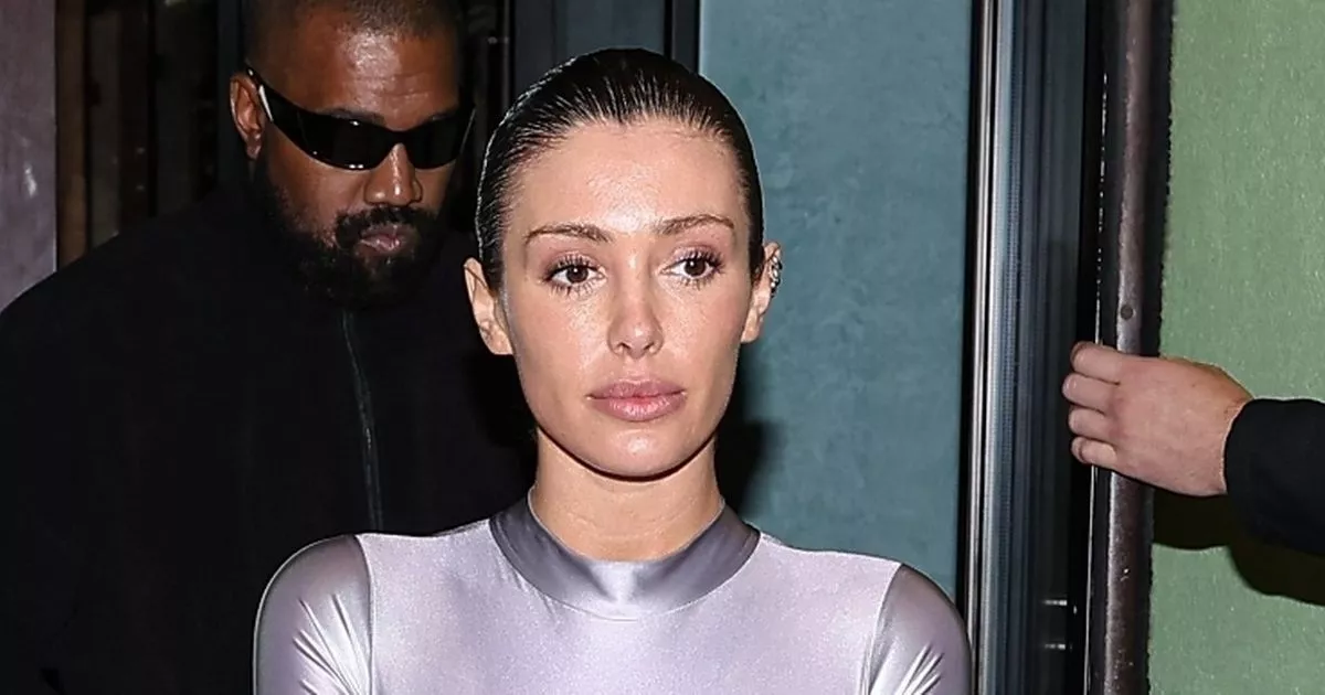 Bianca Censori braless in silver catsuit for outing with Kanye's four young kids