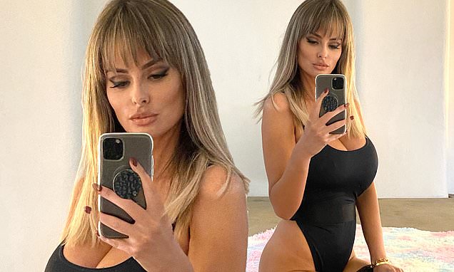 Rhian Sugden flaunts her curves in black bodysuit and stockings
