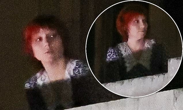 Lady Gaga looks unrecognizable in a red wig as she films music video